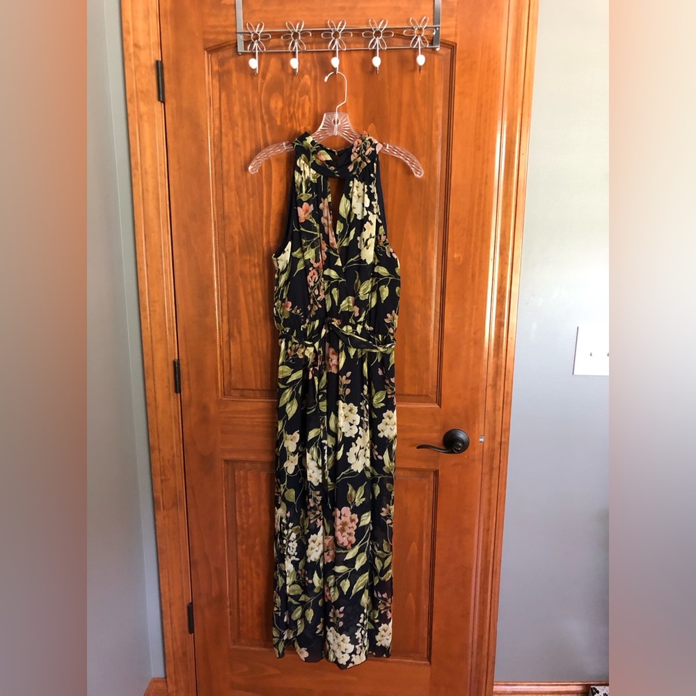 Floral summer dress in EUC.  Opening in front and back.  Elastic waist, size 12.